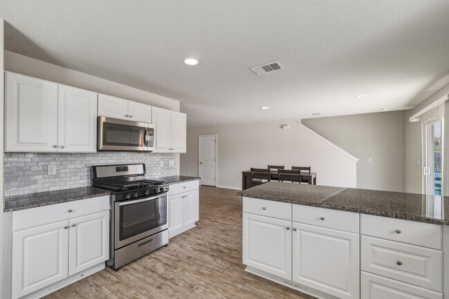 Building Photo - Gated Community Home with Solar Panels & All Appliances Included