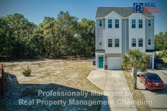 Building Photo - Spacious 3-Story Townhome in the Heart of Carolina Beach — Backs to State Park