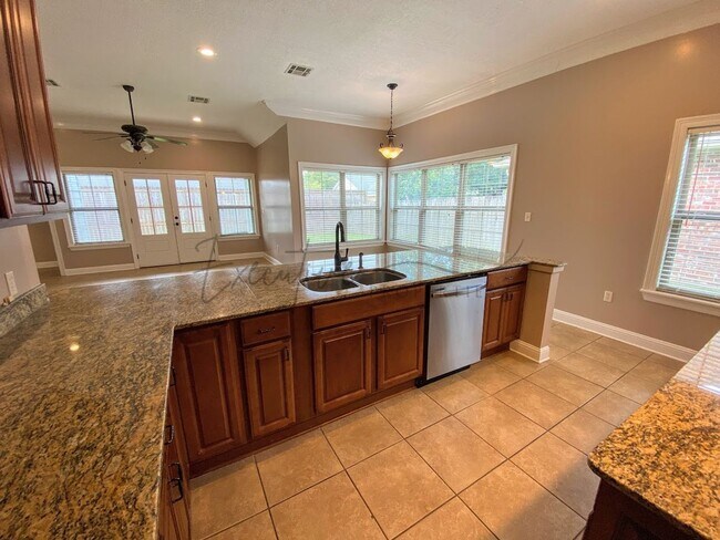 Building Photo - Family Home in Lafitte Landing – Fenced Ya...