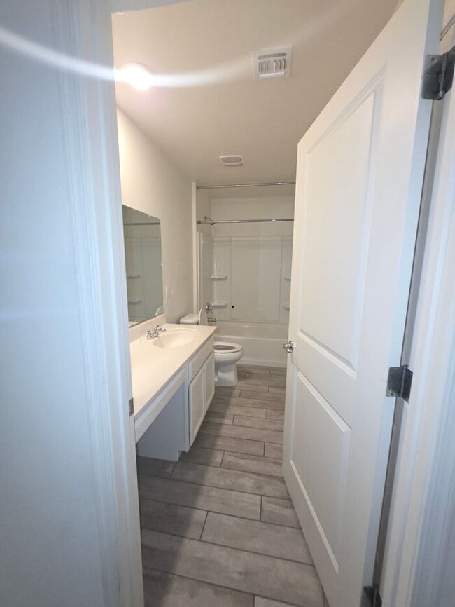 Building Photo - COMING SOON! New 3BR 2 BA Home w/ 2-Car Garage • Stainless Kitchen • Timer-Irrigated Yard in East...