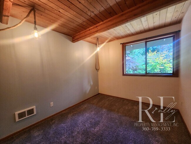 Building Photo - Waterfront Living in Indianola – Dock, Bea...