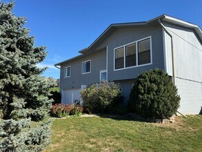 Building Photo - Bright and spacious split-entry home with a finished lower level, large yard, and plenty of updates!