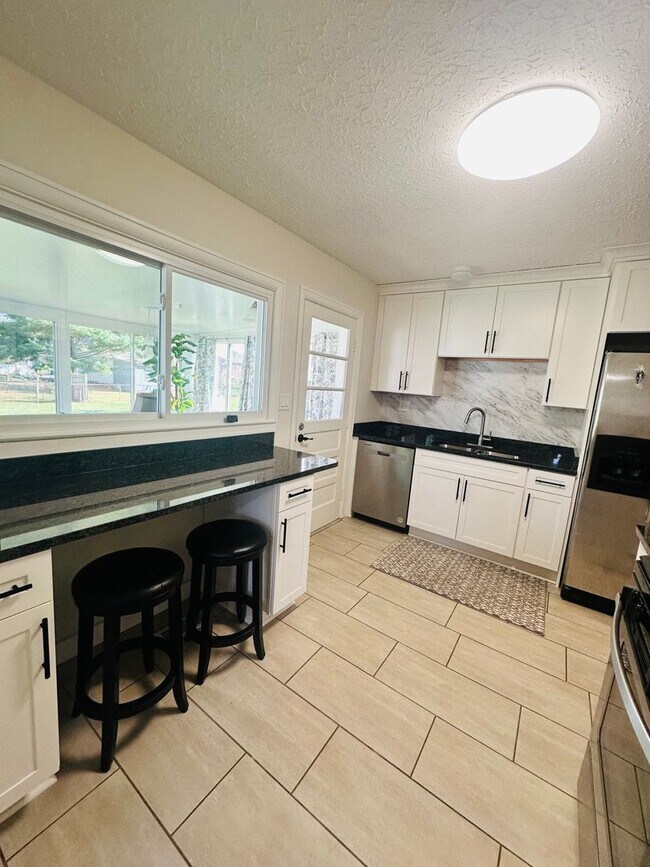 Building Photo - Charming and Updated Cul-de-Sac Gem with Year-Round Sunroom and Spacious Backyard!