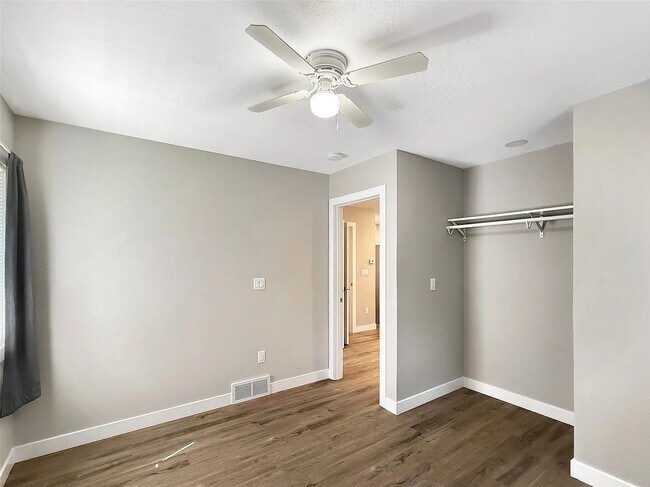 2nd bedroom with clothes hanging rack - 2610 63rd St