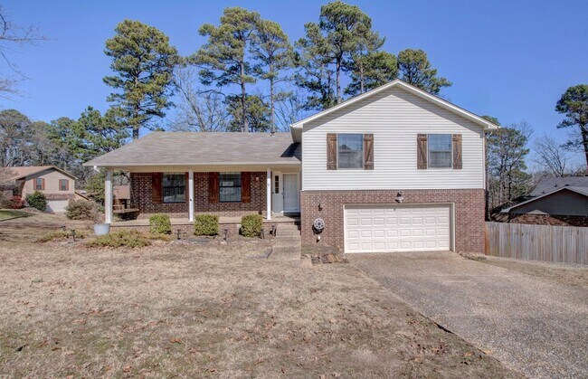 Building Photo - Welcome Home: Charming Brick Beauty with Covered Porch.