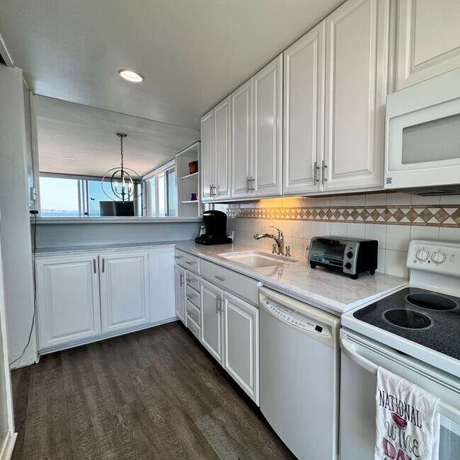 Building Photo - Just Unpack, Pour a Beverage, & Cue the Su...