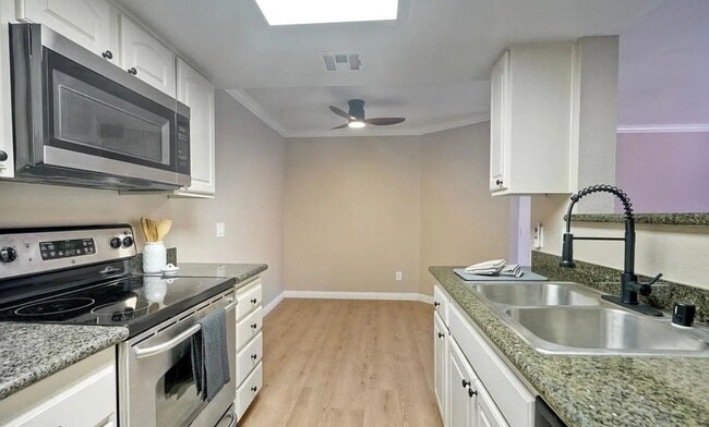 Building Photo - Welcome to this beautifully refreshed 1-be...