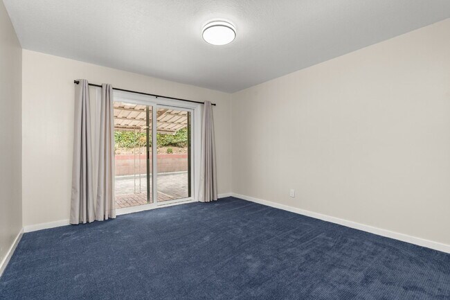 Building Photo - Charming Updated Home With Drive-Through Garage Access