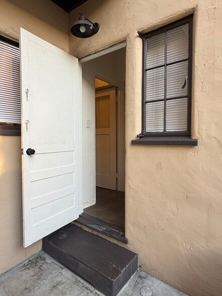Back door with dust and dawn light fixture - 795 N 2nd St