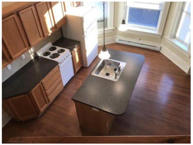 bedroom overlooks kitchen and living area - 801 S Main St