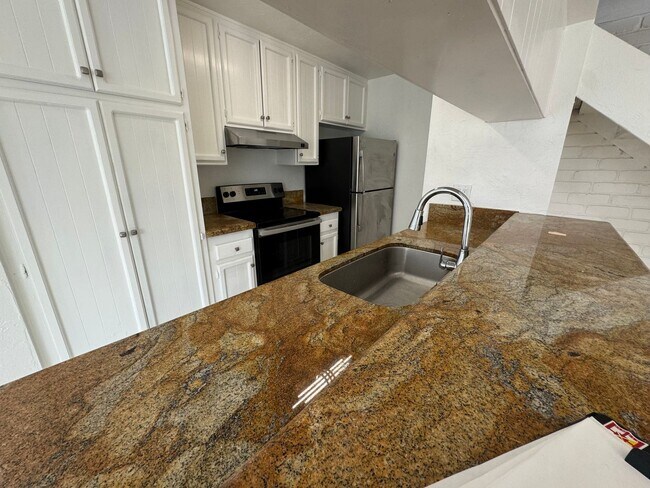 Building Photo - Two-Story 2 Bedroom, 1 Bath Lakeside Condo with Solar!