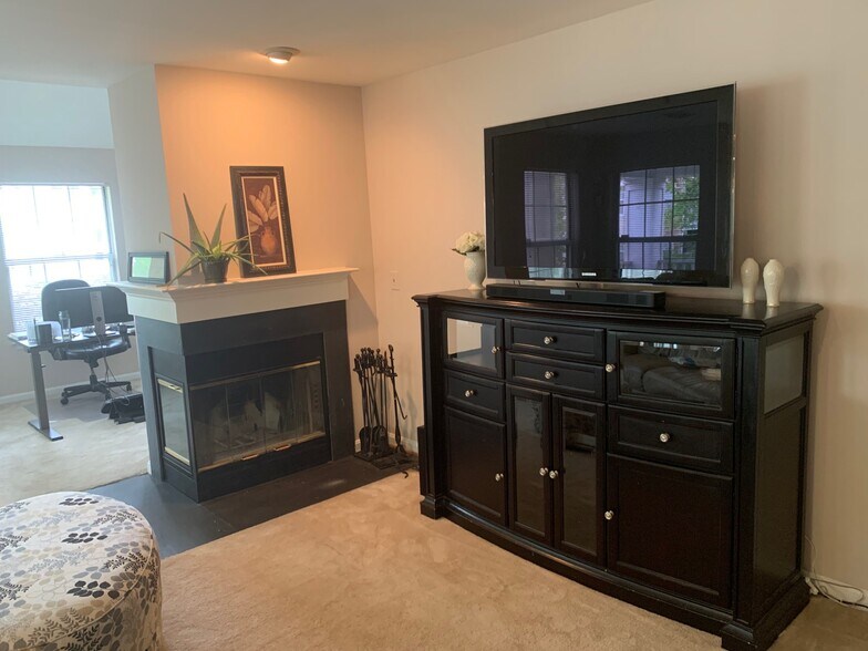 Living Room with Wood-Burning Fireplace - 5608 Willoughby Newton Dr