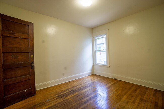 Building Photo - First Floor 3 Bedroom Apartment Close To C...
