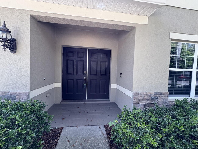 Building Photo - Spacious 5-Bedroom Pool Home with Putting ...