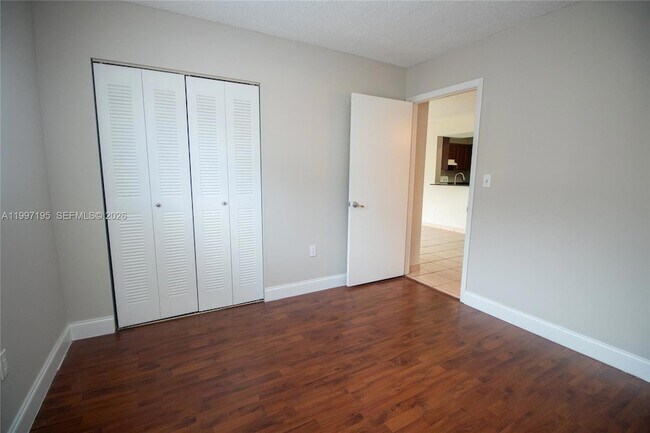 Building Photo - 9491 Palm Cir S