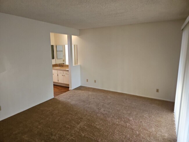 Building Photo - Spacious 4-Bedroom Home with Large Backyard & Covered Patio!