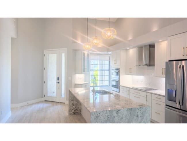 Building Photo - Elegant, Fully Renovated Townhome in Gated Grand Haven Community!