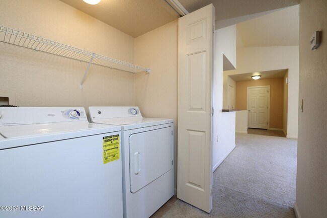 Washer Dryer Closet in Hallway - 101 S Players Club Dr