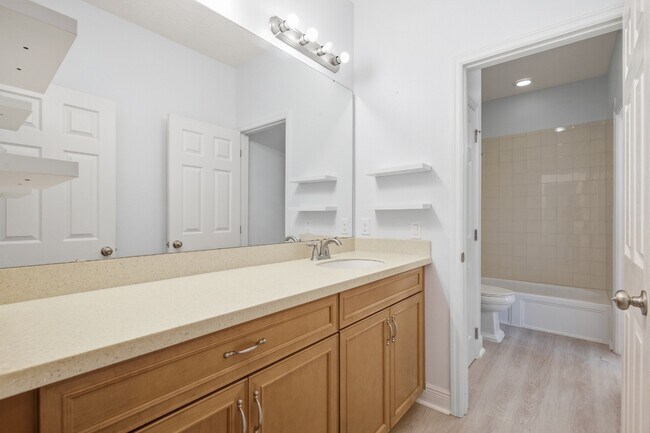 Building Photo - Spacious 6-Bedroom Home Near Lake Nona | 3-Car Garage + Tesla Charger