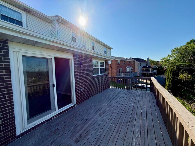Building Photo - Modern Comforts Await: Spacious Rental with 2-Car Garage, Private Office, and Finished Basement w...