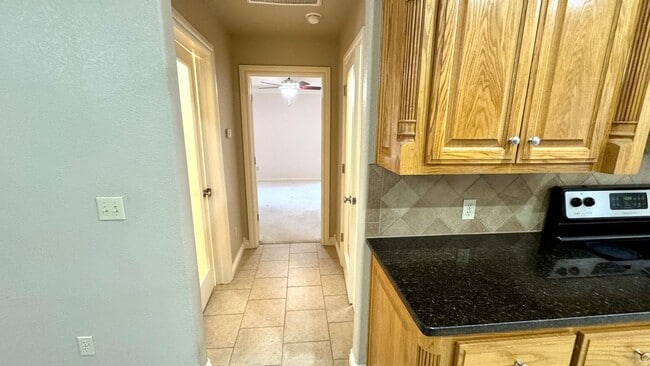 Building Photo - Spacious Stonegate Retreat with Home Office & Outdoor Living