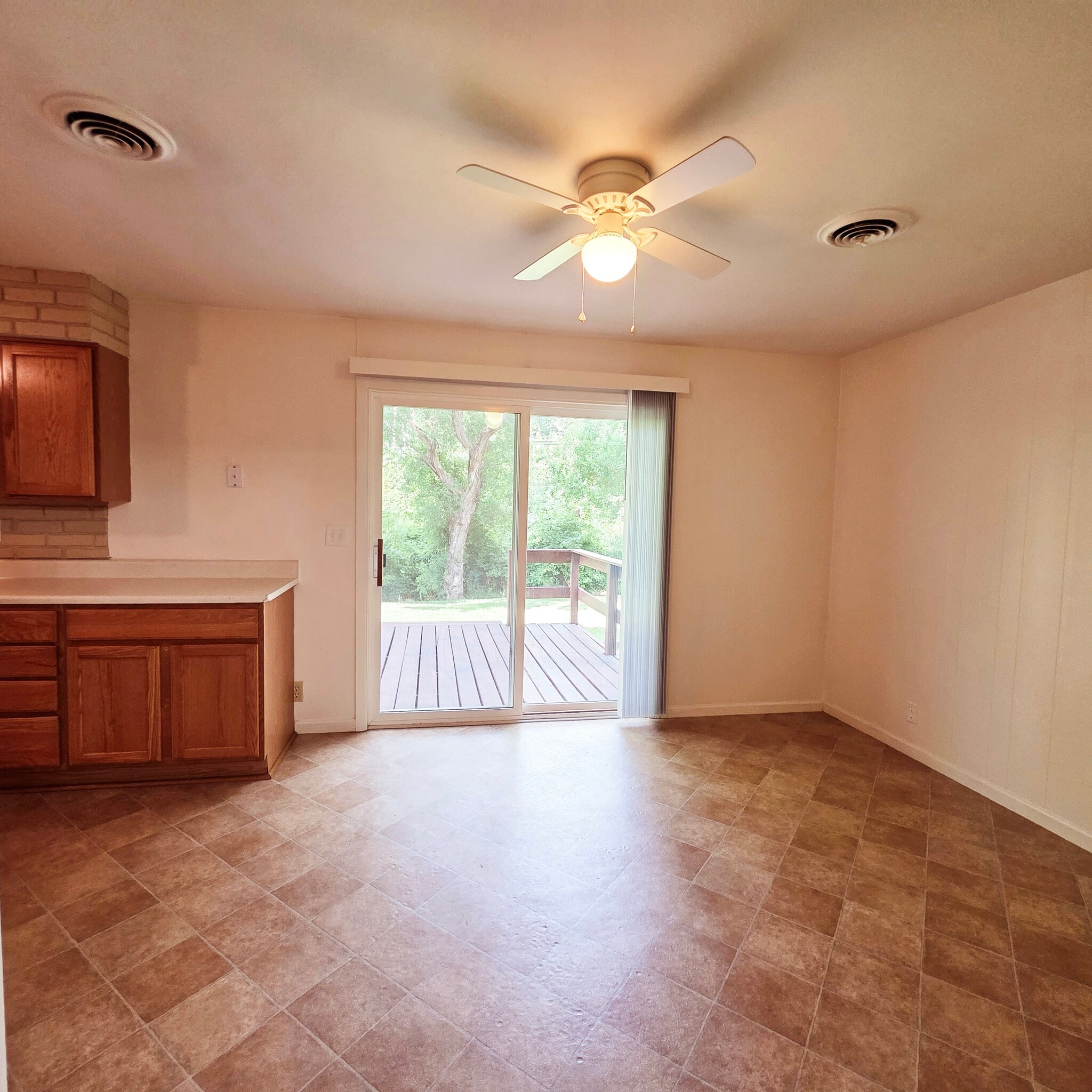 Dining with sliders to large private deck - 5205 N Montclair Ave