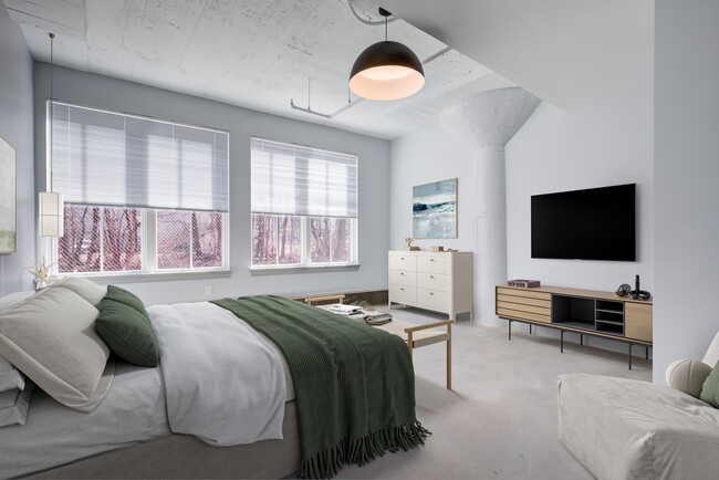 Zeropak Apartments - Bedroom with TV and Dresser - ZeroPak Apartments