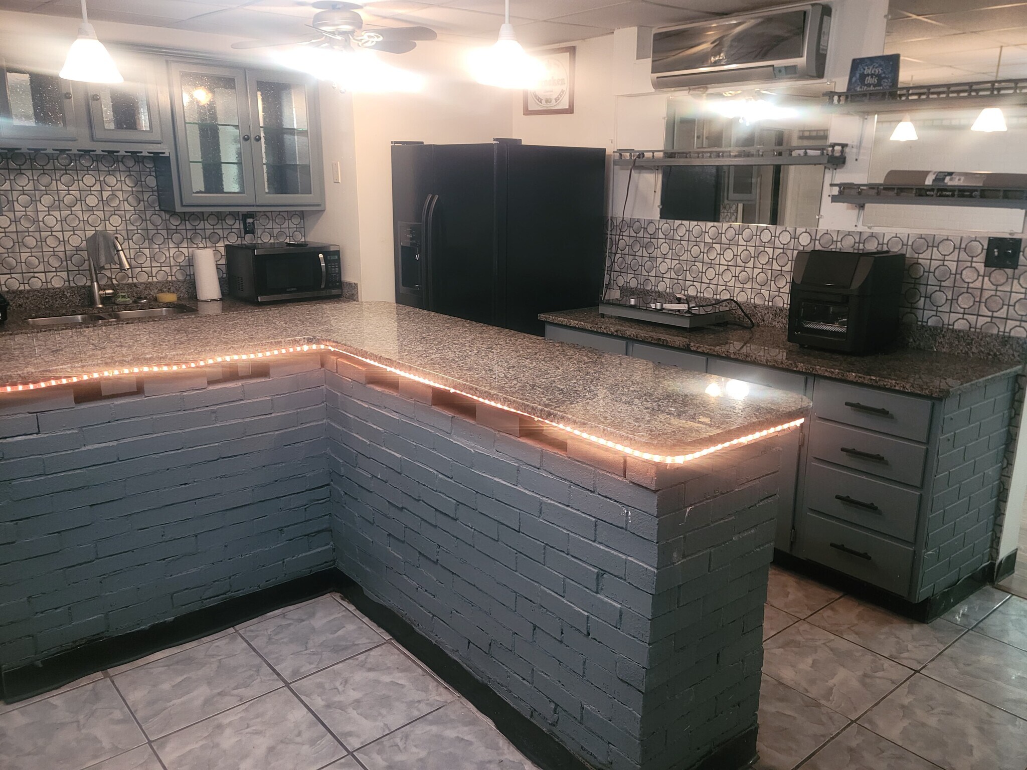 Kitchen with fridge, sink, air fryer, & microwave - 5898 Manchester Ln