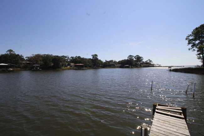 Building Photo - 2-Bedroom Waterfront Townhouse with Community Pool – Available 11/26