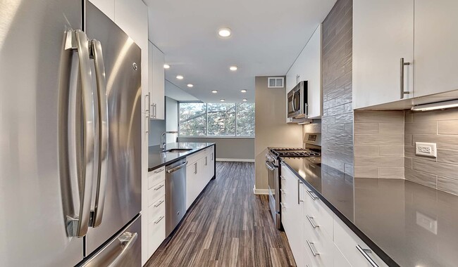 Kitchen opens up to the living and dining room. - Yorktown Apartment Homes