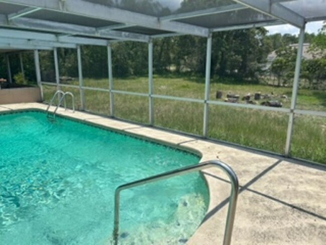 Building Photo - Large  3 bedroom, 2 bath pool home.