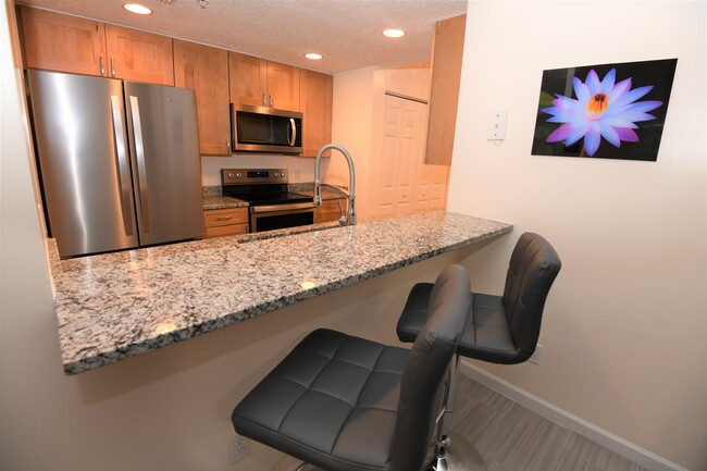 Newly updated kitchen. - 5799 NE Island Cove Way