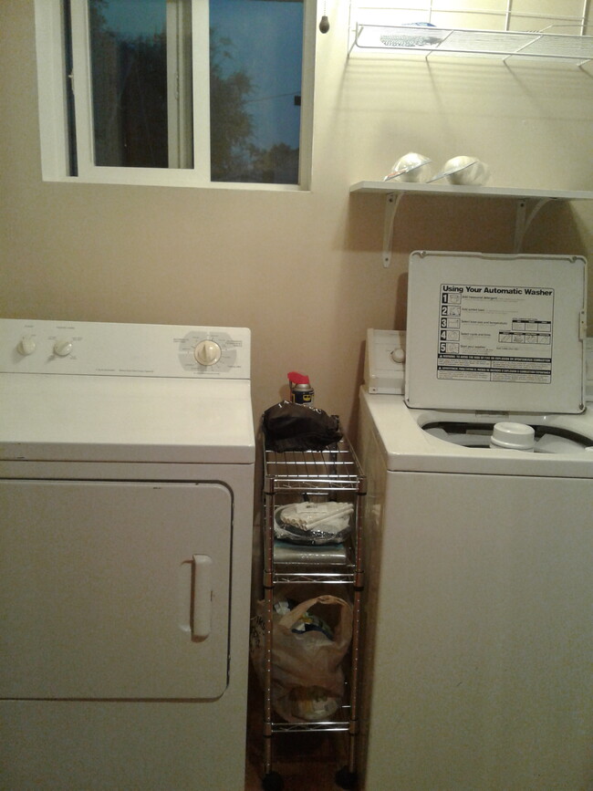 Laundry room in a closet off the kitchen. Maximized tight spaces! - 2914 Woodlawn Avenue