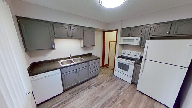 Building Photo - Updated 2BR/1BA duplex with office in partially finished basement, detached garage and across fro...