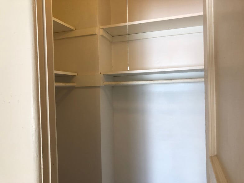 Step-in closet with plenty of storage and light - 6432 Smoketree Ave