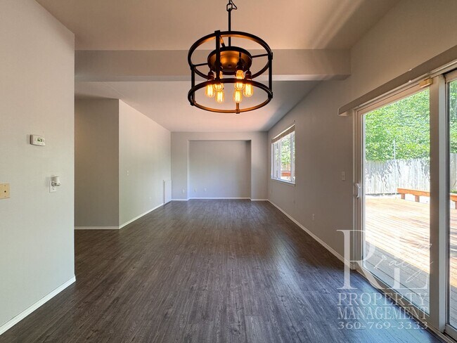 Building Photo - Dual Primary Suites, Huge Backyard Deck & Sun-Filled Living Spaces Near Everyday Conveniences