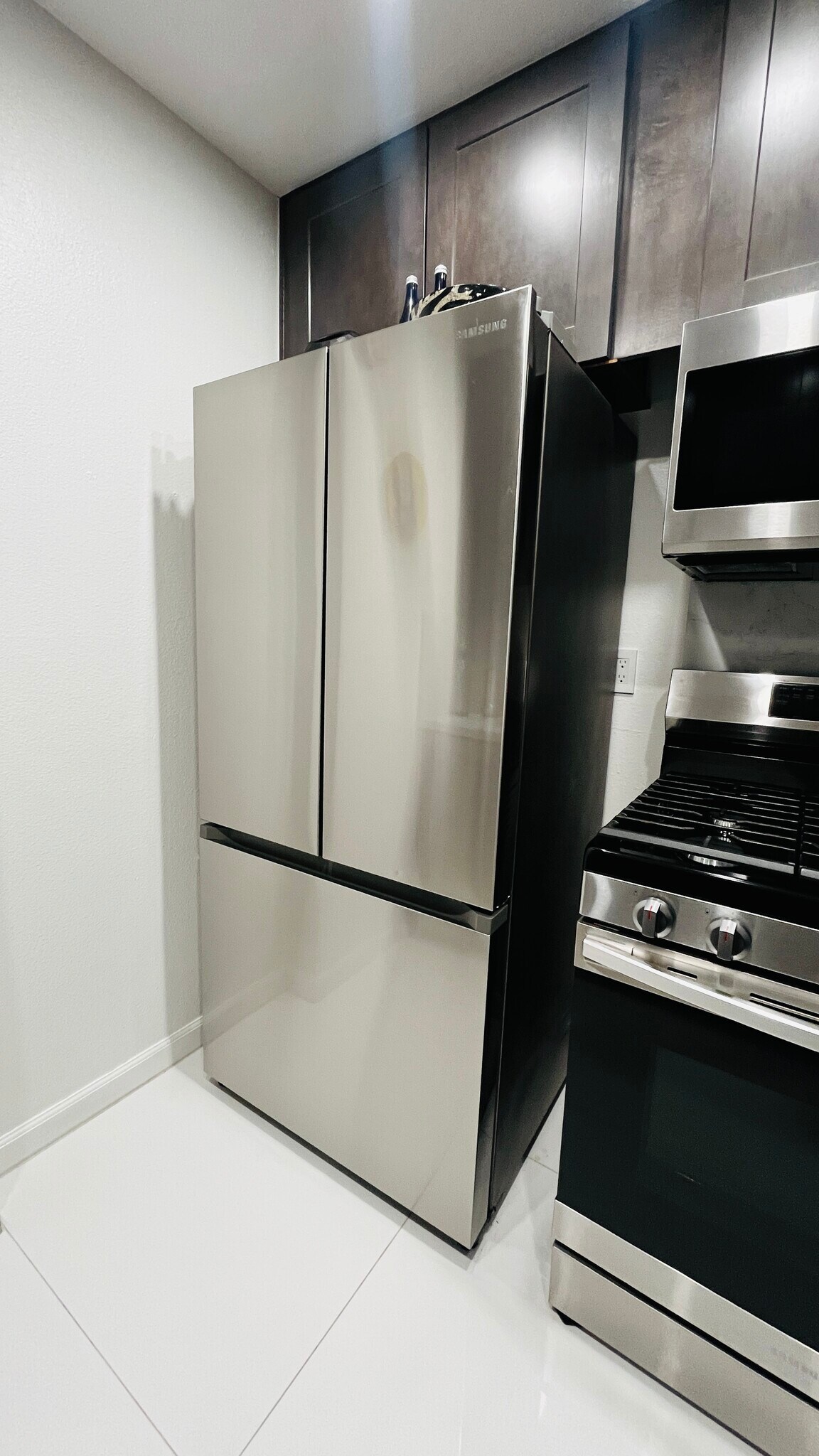 New kitchen With stainless steel refrigerator, dishwasher, microwave, and stove. Garbage disposal - 6600 Warner Ave