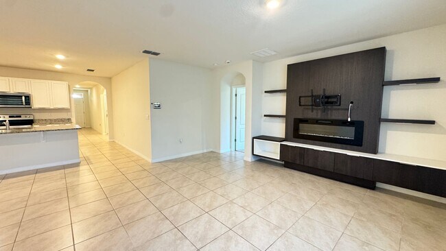 Building Photo - Available NOW! Spacious 4BD/2BA Haven in Villages at Harmony – Your Dream Home Awaits! WASHER & D...