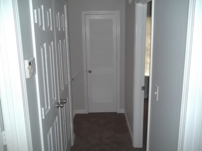 Building Photo - Freshly painted and new flooring in this 4 Bedroom 2 and Half Bath home. Covered front porch with...