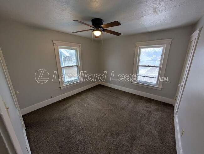 Building Photo - Updated Two-Bedroom Townhome with Lawn Care Included