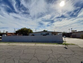 Building Photo - 4 bedrooms and 2 bathrooms with A/C.