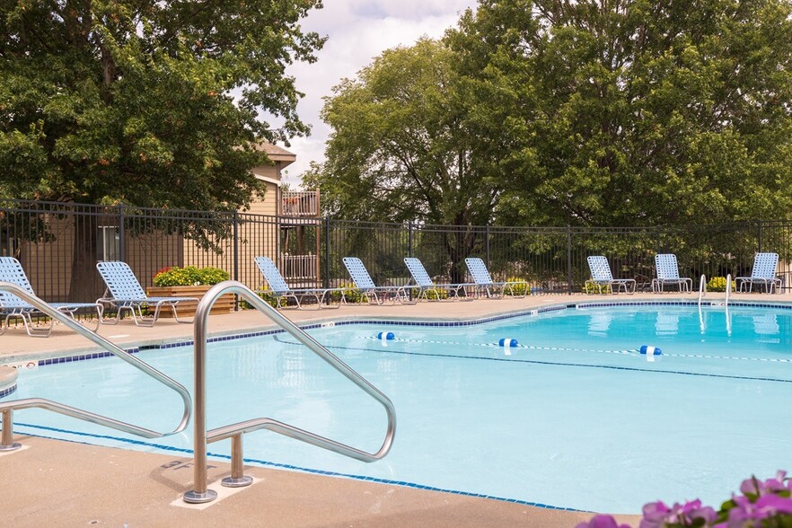 Cool off and enjoy the serene atmosphere of our pool, where relaxation meets community living. - Wilshire Apartments