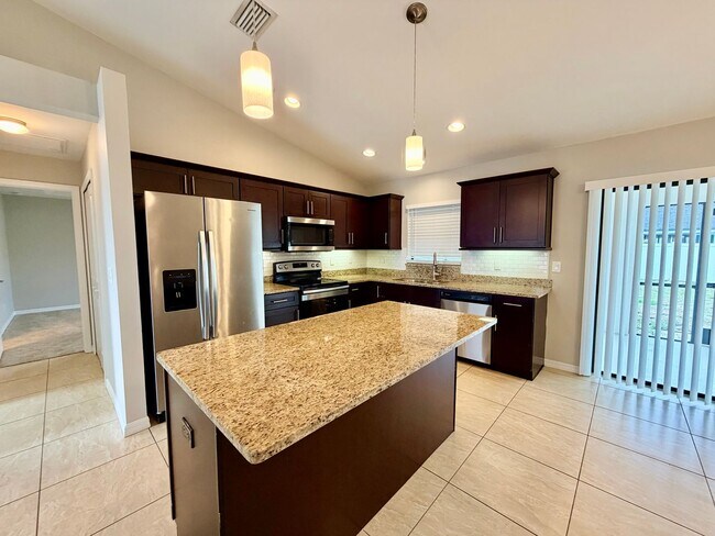 Building Photo - Move-In Ready 3BR Home in SW Cape Coral with Fenced Yar+Screened Lanai+Lawn Care Included+Pet Fri...