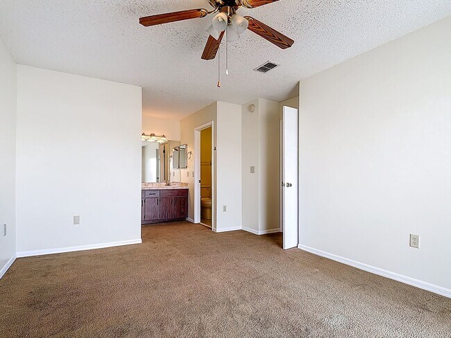 Building Photo - Spanish-Style 3 Bedroom, 2.5 Bath Mediterranean Rooftop Townhouse – Basic Cable & Wi-Fi Included!