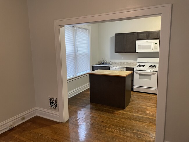 View into kitchen from the front living room - 5033 Devonshire Ave