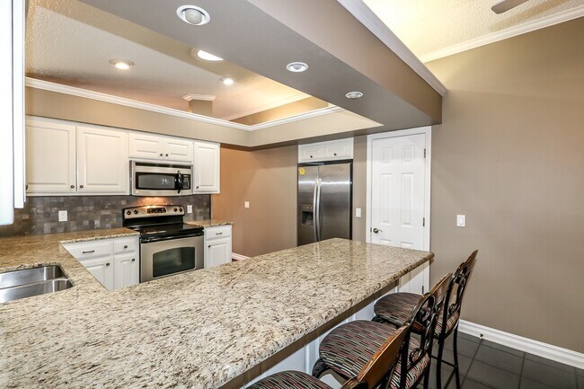 Building Photo - Beautiful 4 Bedroom, 3 Bath home. It has a 2 car garage plus a 1 car carport.  Stay warm in the w...