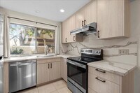 Building Photo - Spacious Tri-Level Townhome with Private Garage and Renovated Kitchen