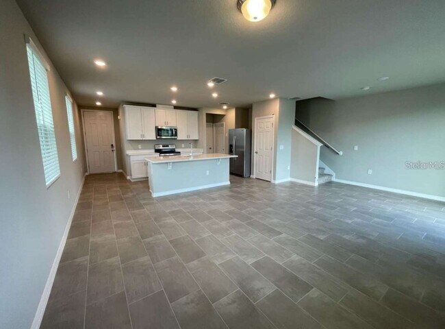 Building Photo - Beautiful corner unit townhouse features an abundance of natural light.