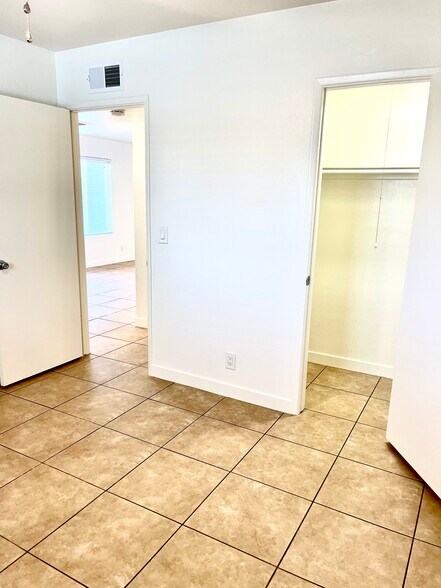 BEDROOM WITH WALK-IN CLOSET - 1058 W Flint St