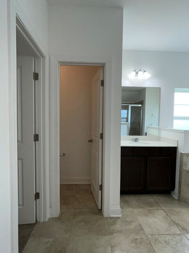 Building Photo - "Spacious 4-Bed Oasis with Stunning Lake V...